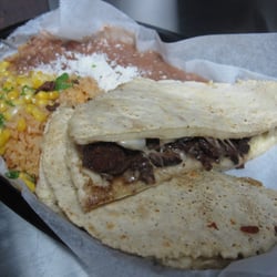 L' Patron Tacos - Chicago, IL, United States. the gringo: masa filled with steak and cheese. comes with rice and beans.
