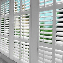Rick's Custom Shutters and Blinds logo