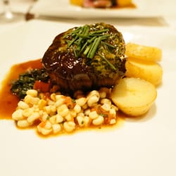 Seared Filet of Beef with Cumin Potatoes, Swiss Chard, Tomato-Corn Relish and Basil Butter