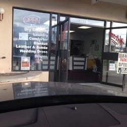 Elegance Dry Cleaners logo