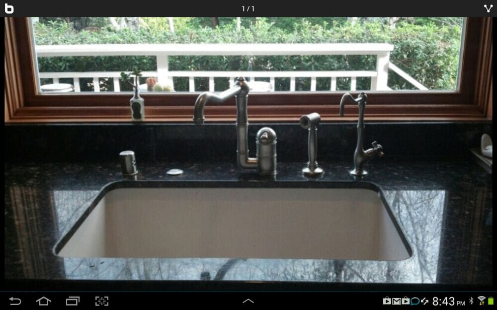 A Single Handle Rohl Kitchen Faucet With Side Mount Pullout
