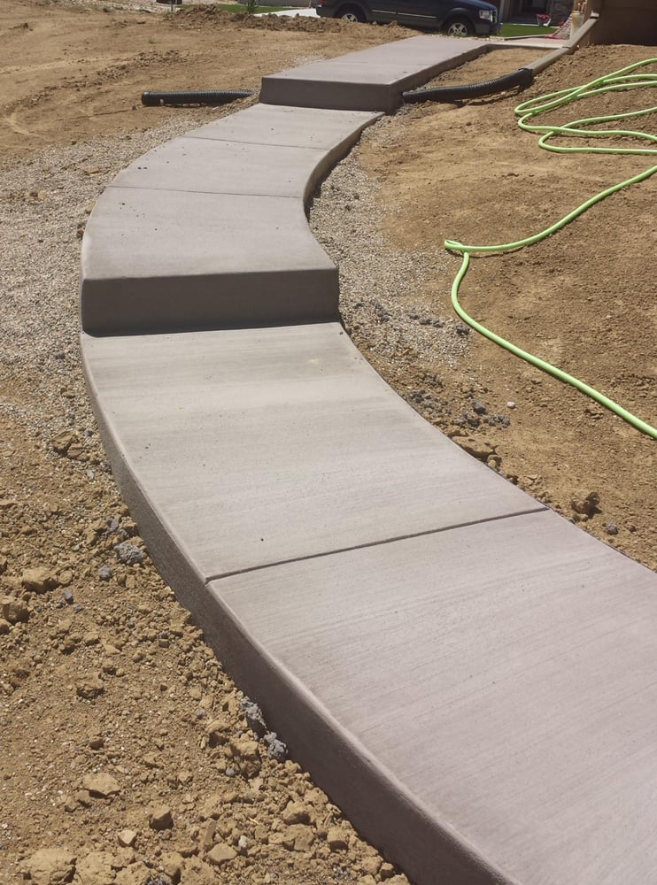 Sidewalk With Step Down From Garage Door To Patio Poured Photo Of Cesar S Concrete Johnstown Co United States Sidewalk With Step Down