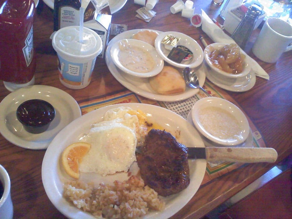The Country Boy Breakfast w/ steak 3 eggs, hash browns, biscuits 'n