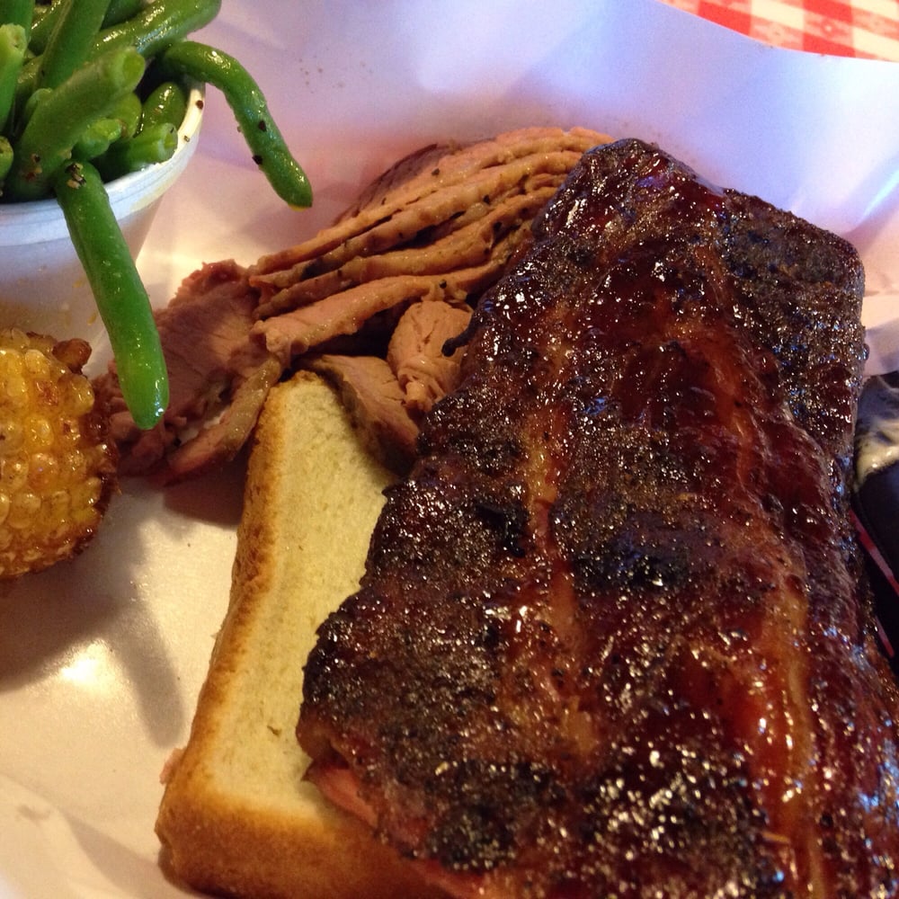 Beef brisket, ribs, deep fried corn on the cob, and green ... Beef brisket, ribs,