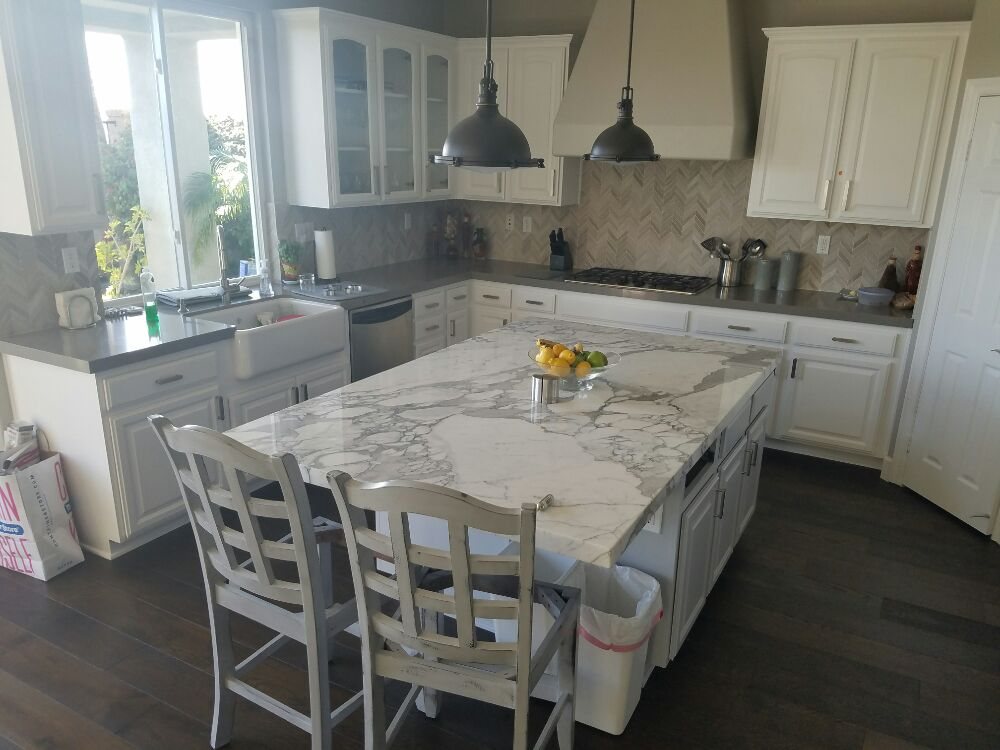 Marble Island With Solid Color Quartz On Surrounding Counters Yelp