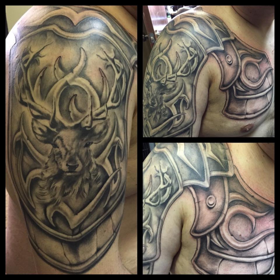 shoulder and chest armor tattoo with a stag and tribal design yelp shoulder and chest armor tattoo with a stag and tribal design yelp