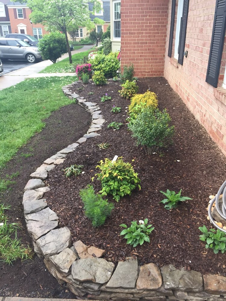 Front Flower Bed Flagstone Edging With New Plants Yelp Photo Of Landscapes By Wade Inc Alexandria Va United States Front Flower