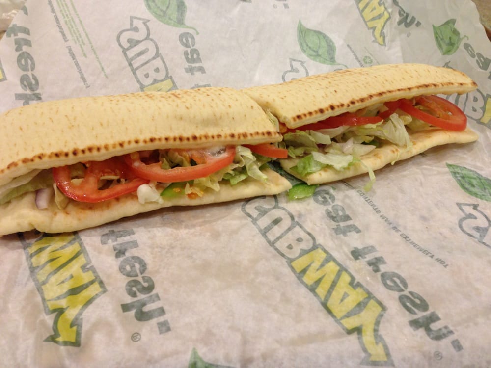 Oven roasted chicken on flat bread with American cheese, onions