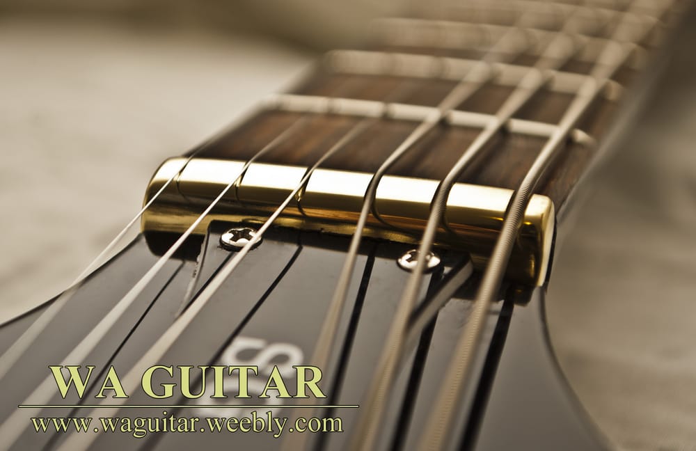 A brass nut made for the Gibson SG, tuned to Drop C with a custom