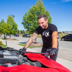 Photo of Fiix - Toronto, ON, Canada. Andrew performing a clean, mess-free oil change on Jahmal's Mercedes.