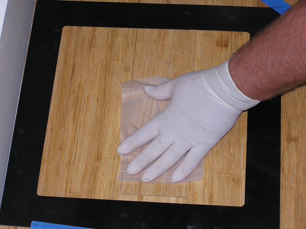 taking a dust wipe