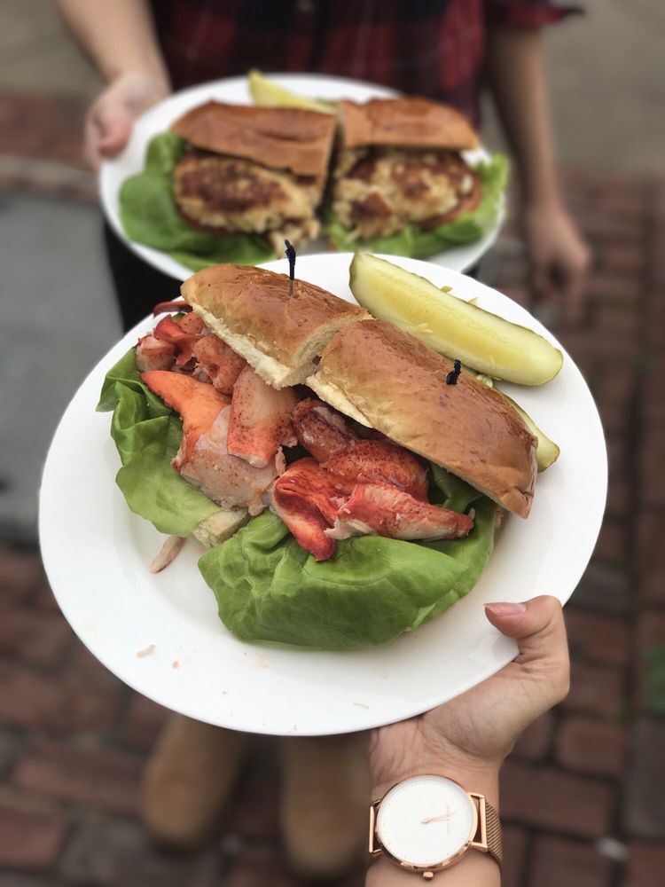 Lobster roll and crab cake sandwich in the back Yelp