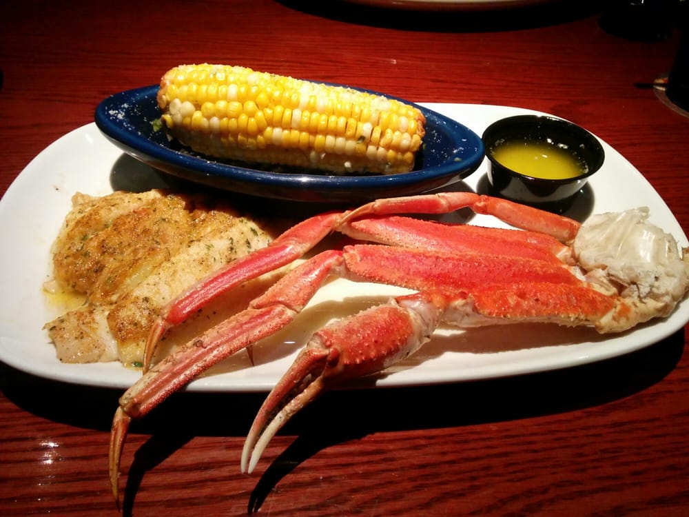 Seafood stuffed flounder with snow crab legs and parmesan crusted corn