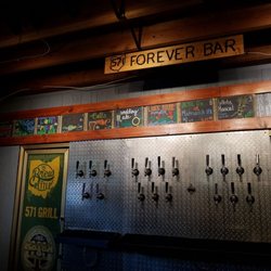 Photo of 571 Grill & Draft House - New Carlisle, OH, United States. Cozy up to the Forever Bar