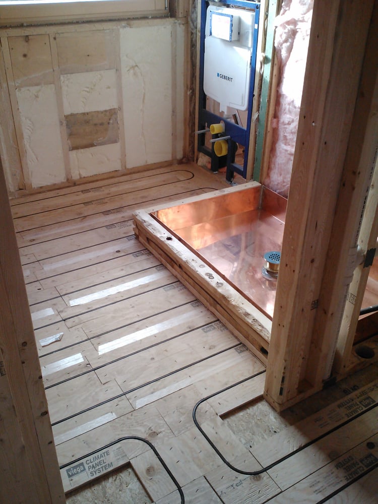 New construction radiant heated floor, wall mounted toilet/water