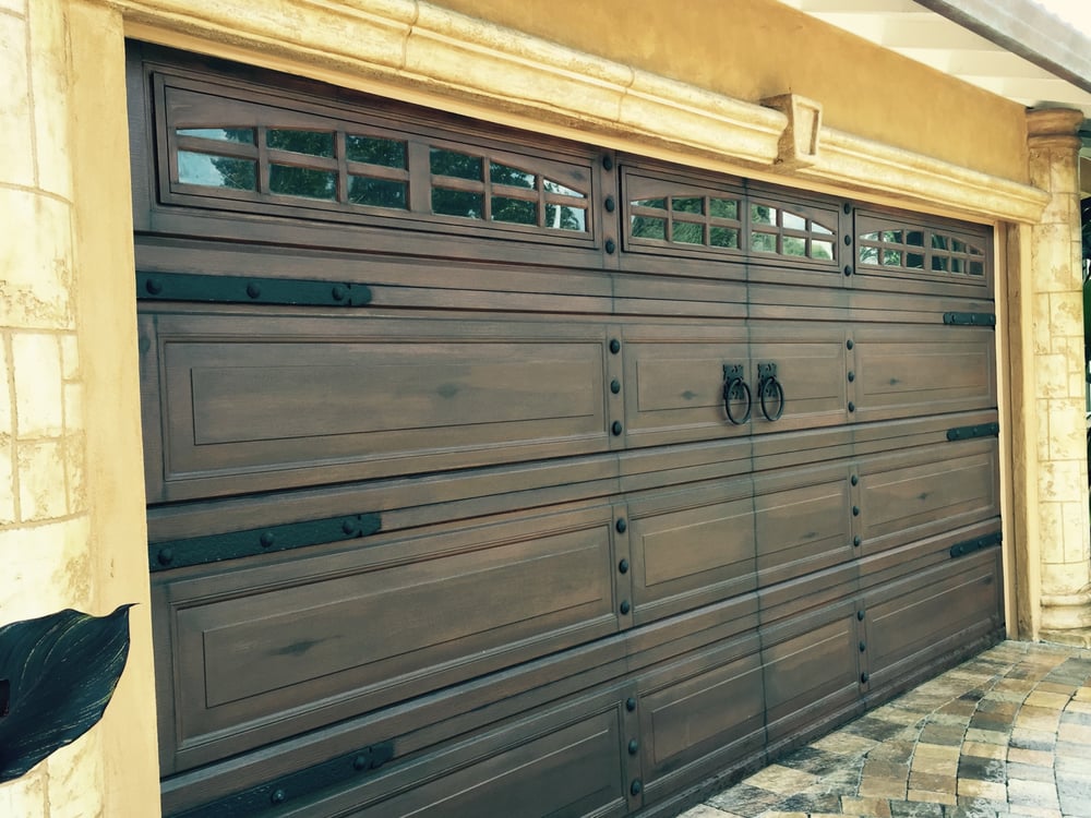 Garage door faux painted and glazed to look like a wooden carriage
