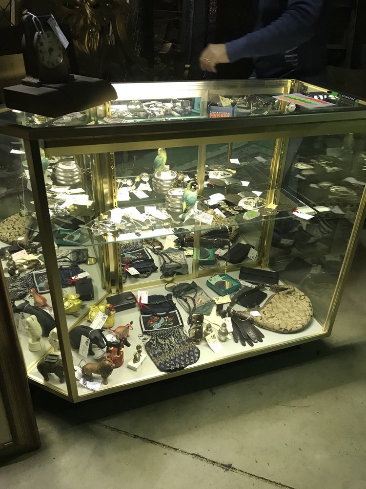 Display Case Full Of Collectibles Silver Spoons Antique Wind Up Photo Of Kelly S Furniture Warehouse Jacksonville Fl United States Display Case Full