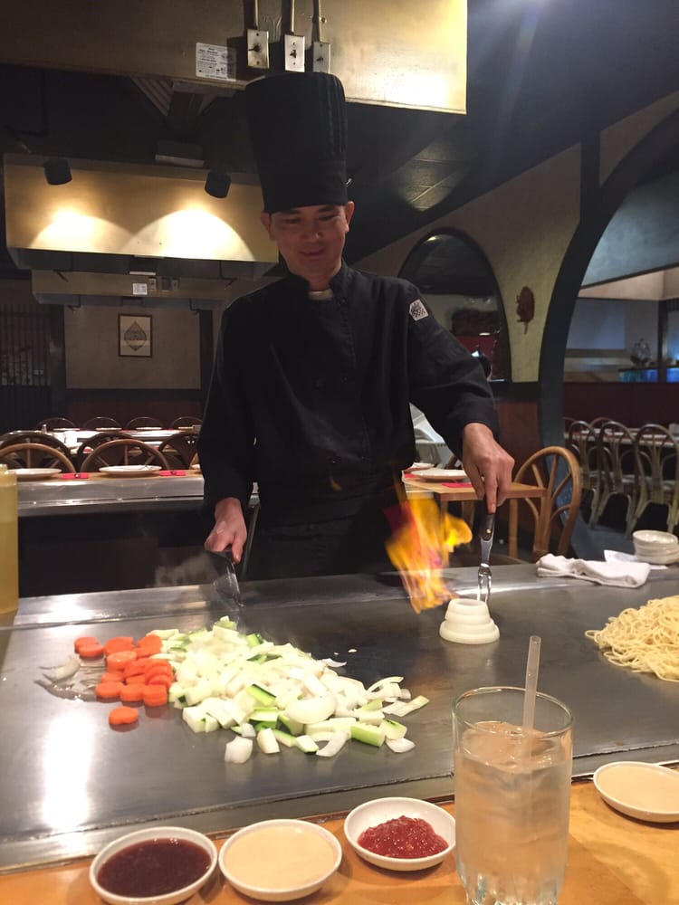 Hibachi chef making the "onion volcano" Yelp