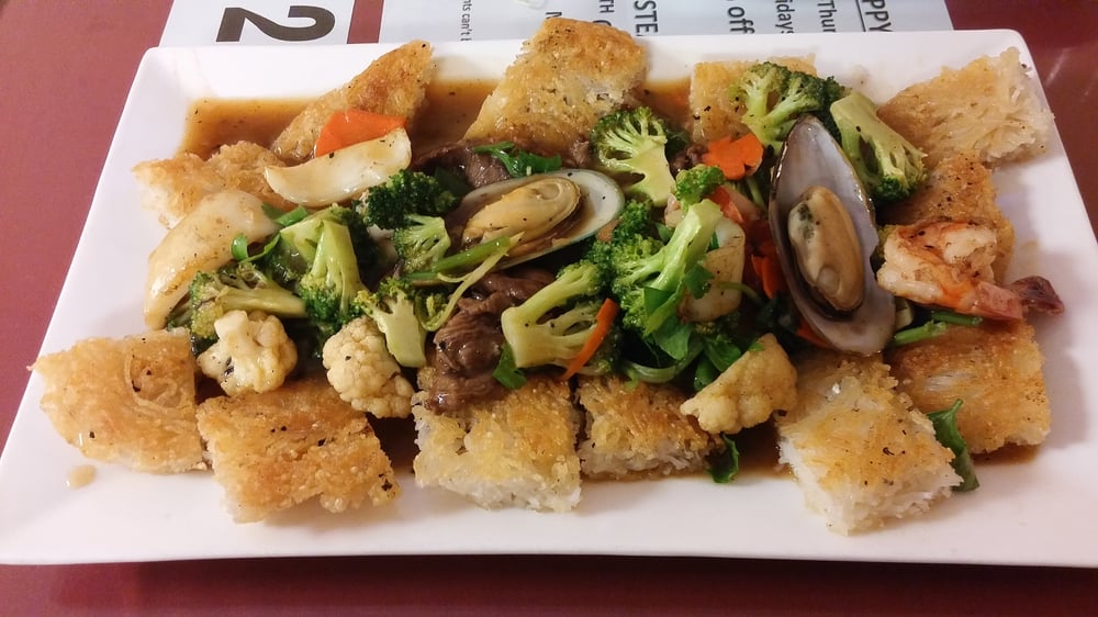 Pho Ap Chao (pan fried pho) w seafood + beef. Largest