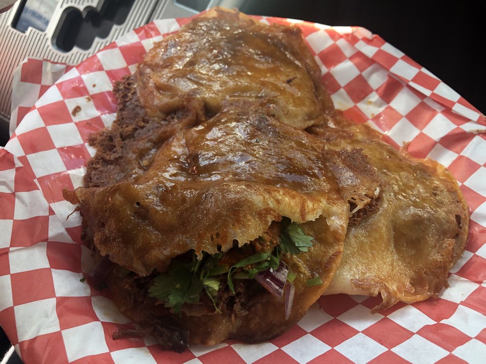 Taco vampiro dippin' in consome from the Birrieria San Marcos truck r/LosAngeles