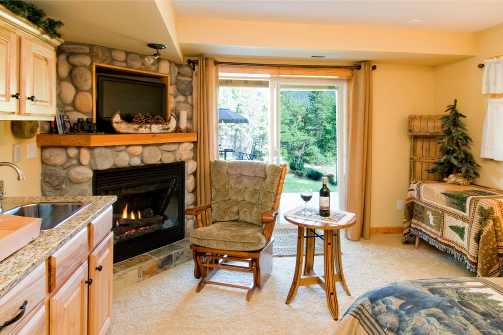 The Alpine Suite...relax by the corner river rock gas fireplace in your
