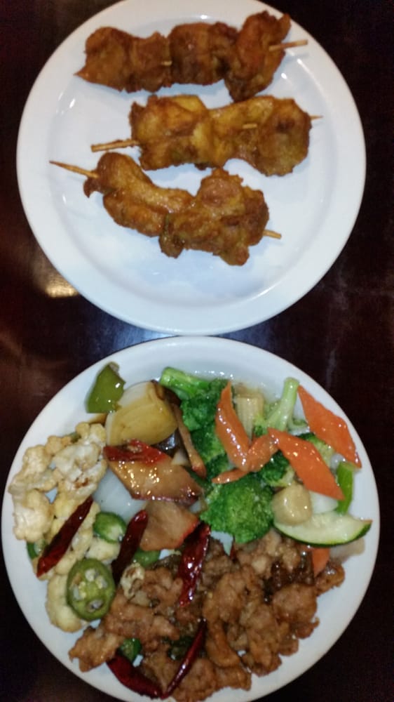 cat on a stick curried chicken skewers top steamed vegetables
