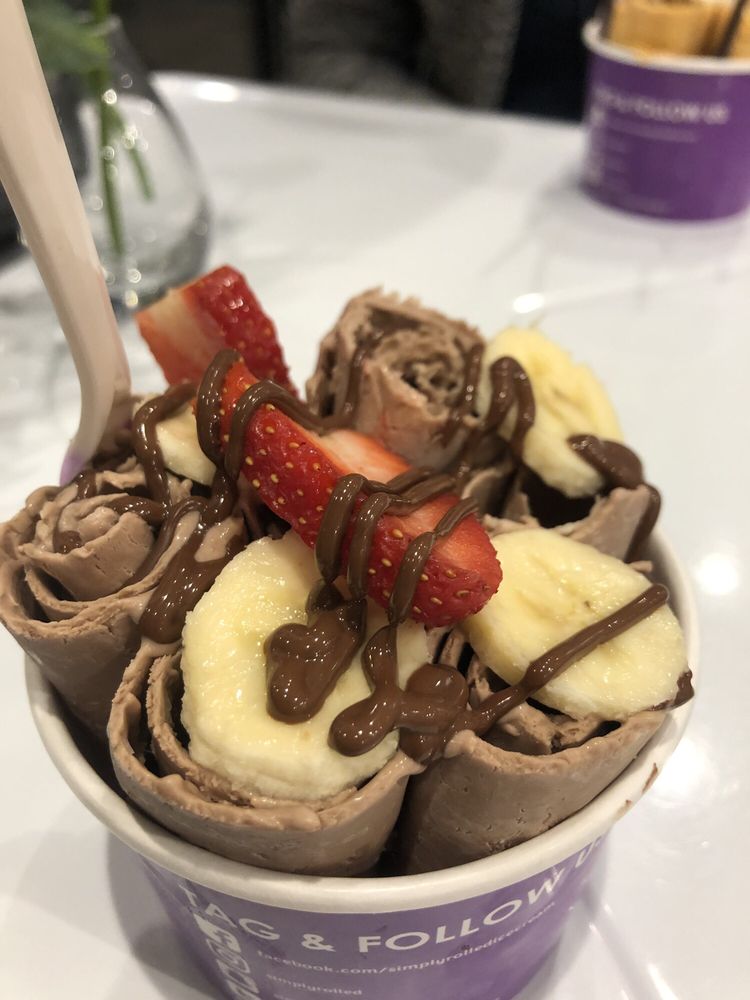 Photo of Simply Rolled Ice Cream - Cincinnati, OH, United States. Did the #1 Banana Nutella but added strawberries and changed vanilla for chocolate.