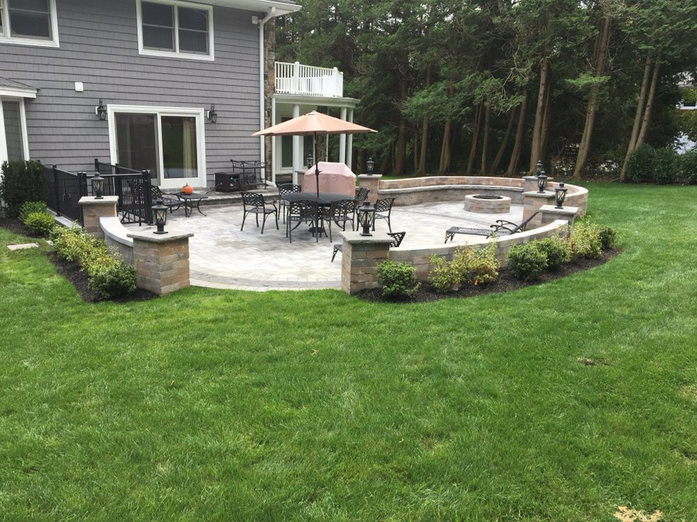 Complete Backyard Paver Patio With A Fire Pit And Seating Walls New Photo Of Jl Posillico Landscaping East Meadow Ny United States Complete Backyard