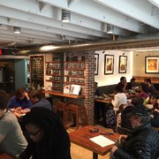 Photo of Politics & Prose - Washington, DC, United States. A busy Sunday in the remodeled coffee shop space