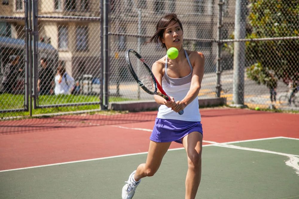 Photo of Tennis Lessons By Mcclain - San Francisco, CA, United States. Notice how Park Couture- custom shirts for men and women, watches the ball to the point of contact