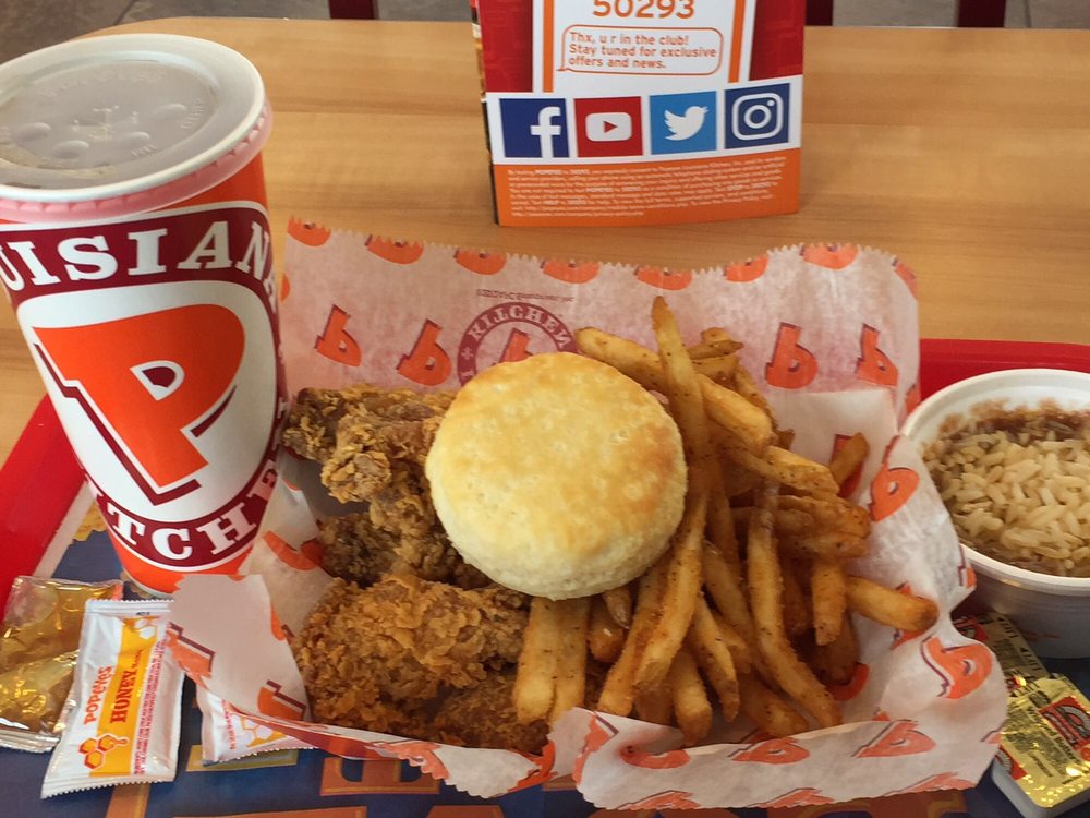 My 6 piece Cajun wing dinner with fries, red beans and rice, biscuit